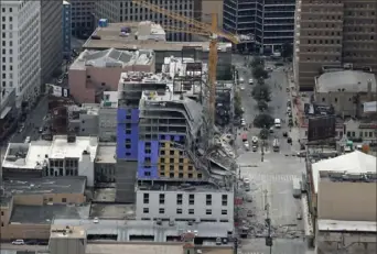  ?? Gerald Herbert/Associated Press ?? This aerial photo shows the Hard Rock Hotel, which was under constructi­on, after a partial collapse Saturday in New Orleans.