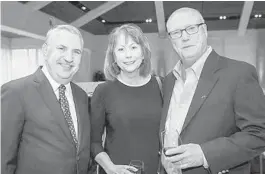  ?? DOWNTOWN PHOTO/COURTESY ?? New York Times columnist Tom Friedman, left, with Sun Sentinel Editorial Page Editor Rosemary O'Hara and her husband, Tom O'Hara. Friedman lays out the unsettling march of technology in his new book: “Thank You for Being Late: An Optimist’s Guide to...