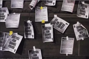  ?? Joshua Rashaad McFadden / TNS ?? Notices reading “Justice for Daniel Prude” are taped to the exterior walls of City Hall in protest of the police killing of Daniel Prude on Sept. 8 in Rochester, N.Y.