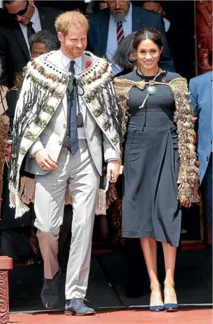  ?? CHRIS JACKSON/GETTY IMAGES) ?? Prince Harry, Duke of Sussex and Meghan, Duchess of Sussex walk out of Te Papaiouru Marae after a luncheon in Rotorua yesterday.