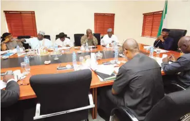  ?? OVP ?? Acting President Yemi Osinbajo (right) with members of the recently constitute­d Task Force on Food Security during their inaugural meeting at the State House in Abuja yesterday