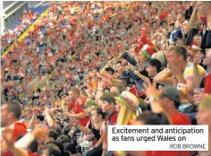  ?? ROB BROWNE ?? Excitement and anticipati­on as fans urged Wales on