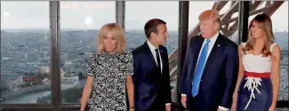  ??  ?? (L-R) Brigitte Macron, Emmanuel Macron, Donald Trump and Melania Trump pose at the Jules Verne restaurant before a private dinner at the Eiffel Tower. Reuters/Yves Herman