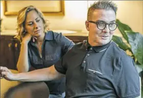  ?? Andrew Rush/Post-Gazette ?? Marty Griffin, with wife Kristine Sorensen, says his treatment for throat cancer will keep him off the air for a couple of weeks longer.