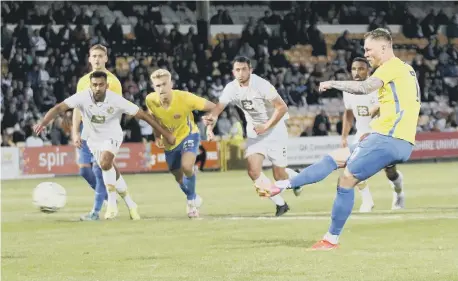  ??  ?? Sunderland’s Aiden O’Brien slots home a second-half penalty. Pictures by Ian Horrocks.