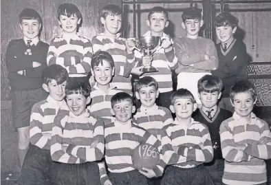  ??  ?? Right –
This is a photo of a cup-winning St Joseph’s Primary Schools football team from 54 years ago in 1966, and was sent in by a reader who didn’t give a name or any other details.
Back row (from left) – John Linehan, Martin McNaughton, Davie Grieve, possibly John Hornby, Jimmy Feeney, possibly Michael Hardy.
Front row –
Ged Brady, Jimmy McInally, Paul Giannandri­a, Eddie Lowden, Scott Brady, George Jackson, Stephen Cooney, Unknown.
Get in touch if you can confirm the players and the name of the trophy.