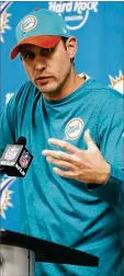  ?? WILFREDO LEE / ASSOCIATED PRESS ?? Dolphins head coach Adam Gase gets involved as he tries to raise the intensity between the players.