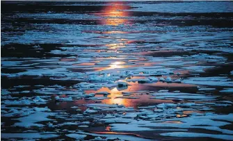  ?? THE ASSOCIATED PRESS ?? Midnight sun shines across sea ice in Canada’s Northwest Passage. The magnetic North Pole is wandering about 55 kilometres a year. At the end of 2017 it crossed the internatio­nal date line.