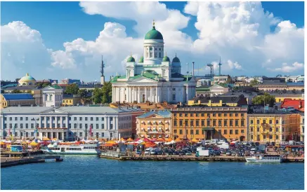  ??  ?? Above and right: Helsinki Cathedral and waterfront; and the dubious pleasures of ice swimming