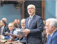  ?? CP PHOTO ?? Quebec Finance Minister Carlos Leitao tables his budget Tuesday at the National Assembly in Quebec City.