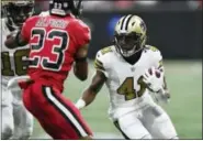  ?? DANNY KARNIK — THE ASSOCIATED PRESS FILE ?? This Dec. 7 file photo shows New Orleans Saints running back Alvin Kamara (41) running near Atlanta Falcons cornerback Robert Alford (23) during the first half of an NFL football game in Atlanta.