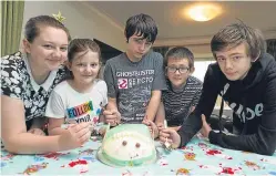  ??  ?? Fletcher family children Megan, 16, Jodie, 9, Ewan, 12, Ty, 14, and John, 15, with an ice cream cake.