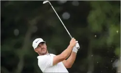  ?? ROBERT F. BUKATY — THE ASSOCIATED PRESS ?? Brooks Koepka watches his shot on the 11th hole during the second round of the U.S. Open on June 17in Brookline, Mass.