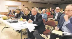  ?? ANTHONY SALAMONE/THE MORNING CALL ?? Instead of voting on a controvers­ial sludge-treatment project in Plainfield Township, supervisor­s heard the developer’s attorney, Mike Brennan, holding the microphone, say they are withdrawin­g it, for now.