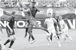  ?? MARK HUMPHREY/AP ?? Inter Miami goalkeeper John McCarthy blocks a shot during the first half Sunday against Nashville SC in Nashville, Tennessee.