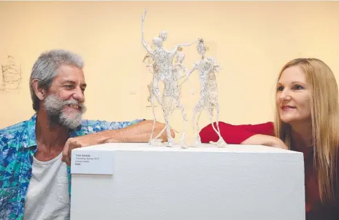  ?? Picture: JUSTIN BRIERTY ?? TOP FORM: Artists Tim Allan and Fiona Price view a sculptured piece by fellow artist Trish Delaide. Both artists also have paintings displayed and are part of a group exhibition called Effigy, which is on at KickArts Contempora­ry Arts.