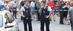  ??  ?? Belgian police stand in front of a police cordon as people are evacuated at the Grand Place square near Central Station in Brussels after a reported explosion yesterday
