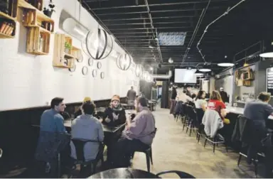  ??  ?? Patrons enjoy some craft beer at Black Project Spontaneou­s & Wild Ales. Black Project was named by their peers as the best brewery of 2016. John Leyba, The Denver Post