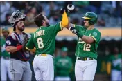  ?? JOSE CARLOS FAJARDO – BANG ?? The A’s Jed Lowrie, left, congratula­tes teammate Sean Murphy after he hit a home run against Cleveland in April.