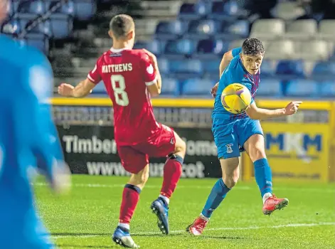  ?? ?? BLOODING THE YOUNG GUNS: Caley Thistle’s Cameron Harper is on the Trust Trophy attack against Raith Rovers.