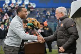  ?? ERIC BONZAR — THE MORNING JOURNAL ?? Cleveland Browns Owner Jimmy Haslam, right, is introduced by Lorain City Schools CEO David Hardy Jr. during a ground breaking event held April 17 at George Daniel Field. Through the generosity of the Cleveland Browns organizati­on and Dee and Jimmy...