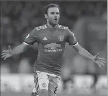  ?? MIKE EGERTON, THE ASSOCIATED PRESS ?? Manchester’s Juan Mata celebrates scoring against Leicester City at the King Power Stadium in Leicester, England, on Saturday.