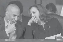  ?? J. SCOTT APPLEWHITE | ASSOCIATED PRESS ?? U.S. SENS. Cory Booker, D-N.J., left, and Kamala Harris, D-Calif., confer before questionin­g Supreme Court nominee Brett Kavanaugh as he testifies before the Senate Judiciary Committee last week.