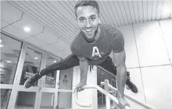  ?? NICK BRANCACCIO ?? Acro athlete James Heugh demonstrat­es some of his acrobatic talent Friday during a visit to the Star. Heugh will be hosting a Christmas charity party — offering to teach his craft