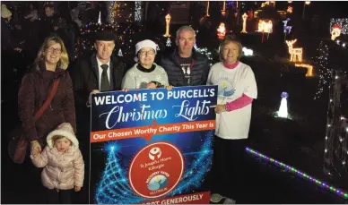  ??  ?? BELOW: Little Aoife McSweeney fairly lighting up herself as she meets a glowing Santa Claus and, left, with Siobhán McSweeney of Recovery Haven, Deputy Michael Healy Rae, Catherine O’Donoghue of Recovery Haven and Joe and Denise Purcell at the...