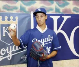  ?? KYODO NEWS VIA AP ?? In this June 8, 2018photo, Kaito Yuki poses for photograph­ers at a press conference in Osaka, western Japan. Yuki is headed to the Kansas City Royals organizati­on instead of attending high school in Japan. The team signed Yuki, a 16-year-old pitcher, out of junior high to a standard seven-year minor league contract Sunday. He is thought to be the first Japanese junior high school player to sign with a major league club.