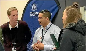  ?? SUPPLIED ?? Work brokers Sam Willis and Mike Riley talking with a young woman at the Porirua Service Centre study expo.