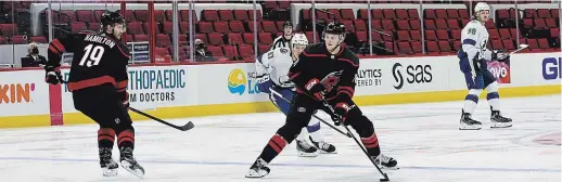  ?? CHRIS DOWNEY CAROLINA HURRICANES ?? Former Peterborou­gh Pete Steven Lorentz handles the puck during his NHL debut against the Tampa Bay Lightning at PNC Arena in Raleigh, N.C., on Thursday night.