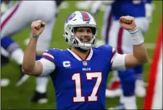  ?? JOHN MUNSON - THE ASSOCIATED PRESS ?? Buffalo Bills quarterbac­k Josh Allen (17) reacts after throwing a touchdown pass in the first half of an NFL football game against the Miami Dolphins, Sunday, Jan. 3, 2021, in Orchard Park, N.Y.