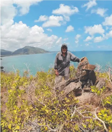  ??  ?? MYSTERY PILE: Far North explorer Ben Cropp climbed a steep cliff to reach the rock cairn near Cooktown, which appears on a map said to have been drawn by Robert Logan Jack in 1890.