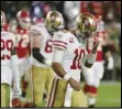  ?? Associated Press ?? ALMOST — 49ers quarterbac­k Jimmy Garoppolo walks to the sideline during the second half of Super Bowl 54 against the Kansas City Chiefs on Sunday in Miami Gardens, Florida.