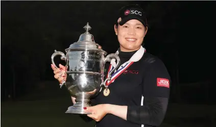  ?? Picture: AFP ?? HEAVY WEATHER. After throwing away a seven-shot at the US Women’s Open on Sunday, Ariya Jutanugarn of Thailand held on to win a play-off.