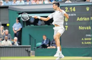  ?? AP PHOTO ?? Novak Djokovic returns to Adrian Mannarino during their Men’s Singles Match on day eight at the Wimbledon Tennis Championsh­ips in London on Tuesday.