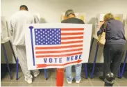  ?? Dan Ocampo / Bakersfiel­d California­n 2004 ?? Voters cast ballots in Bakersfiel­d in 2004. A judge struck down Kern County’s 2011 redistrict­ing plan.