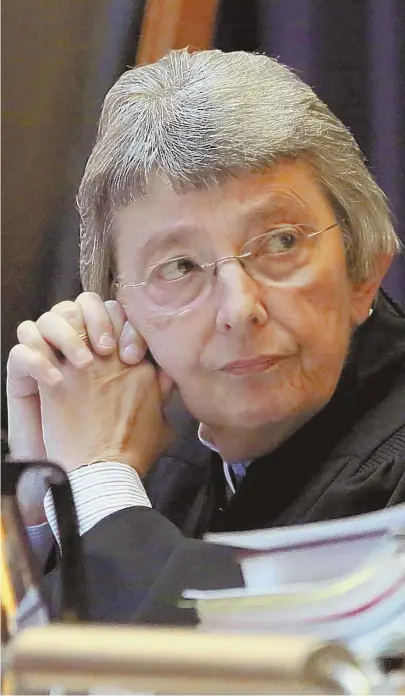  ?? STAFF FILE PHOTO BY ANGELA ROWLINGS ?? ICE BREAKER: The Massachuse­tts Supreme Judicial Court — including Justice Barbara A. Lenk, seen above earlier this year — unanimousl­y ruled that the law provides no authority for Massachuse­tts court officers to hold an individual solely on an ICE...