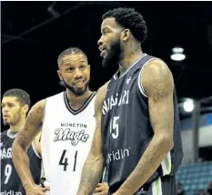  ?? SUPPLIED PHOTO ?? River Lions forward Sam Muldrow and Anthony Cox of the Moncton Magic engage in conversati­on Wednesday night in Moncton.