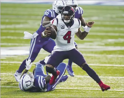  ?? DARRON CUMMINGS — THE ASSOCIATED PRESS, FILE ?? Texans quarterbac­k Deshaun Watson (4) runs against the Colts in the second half on Dec. 20 in Indianapol­is. Thursday’s reports indicate the Texans’ quarterbac­k is mad at ownership and pondering a trade request, mere months after signing a $160 million extension.