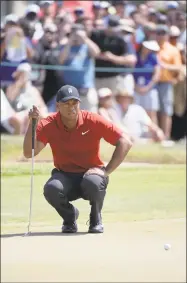  ?? Phelan M. Ebenhack / Associated Press ?? Tiger Woods is the favorite to win the Masters, despite multiple back surgeries and the fact that he hasn’t won a tournament in five years or a major in a decade. It’s not going to happen. It can’t happen. Can it? Gravy writer Chip Malafronte ponders.