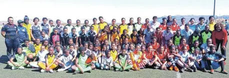  ?? Pictures: LUVUYO MJEKULA ?? WINNING LOOK: Enoch Mgijima Local Football Associatio­n girls’ teams show off their brand new kit donated by the local branch of Safa during a tournament to celebrate Women’s Month at the Dumpy Adams Sports Complex in Komani on Sunday