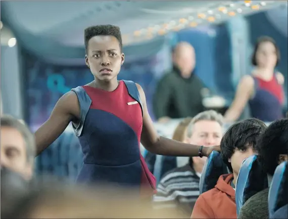  ?? — UNIVERSAL ?? Lupita Nyong’o acts in a scene from Non-Stop, an airborne thriller that asks the viewer to extinguish all thought processes.