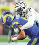  ?? KAREEM ELGAZZAR/USA TODAY SPORTS ?? Rams quarterbac­k Matthew Stafford is sacked by Bengals safety Dax Hill on Monday.