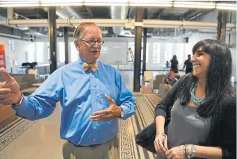  ??  ?? “The economic losses are probably in the billions,” said Tariana Navas-Nieves, director of cultural affairs for Denver Arts & Venues, pictured at right with architect Dennis Humphries at the McNichols building in September 2016.