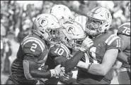  ?? AP/JOHN RAOUX ?? Florida wide receiver Josh Hammond (10) celebrates with running back Lamical Perine (2) after catching a touchdown pass against Auburn during the first half Saturday in Gainesvill­e, Fla.