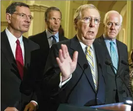  ?? J. SCOTT APPLEWHITE / AP ?? Senate Majority Leader Mitch McConnell said after President Donald Trump overruled congressio­nal Republican­s and cut a deal with Democrats, that the president wanted to present a picture of unity. McConnell is joined by, from left, Sen. John Barrasso,...