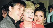  ?? Picture: REUTERS ?? FAMILY AFFAIR: Debbie Reynolds is flanked by her son, filmmaker Todd Fisher, and daughter, Carrie Fisher