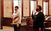  ?? (Caitlan Butler/News-Times) ?? Calion Treasurer Jamie Morgan, left, and Strong Recorder/treasurer Latosha Gatlin, swear their oaths of office before Judge Mary Thomason on Friday, Jan. 1.